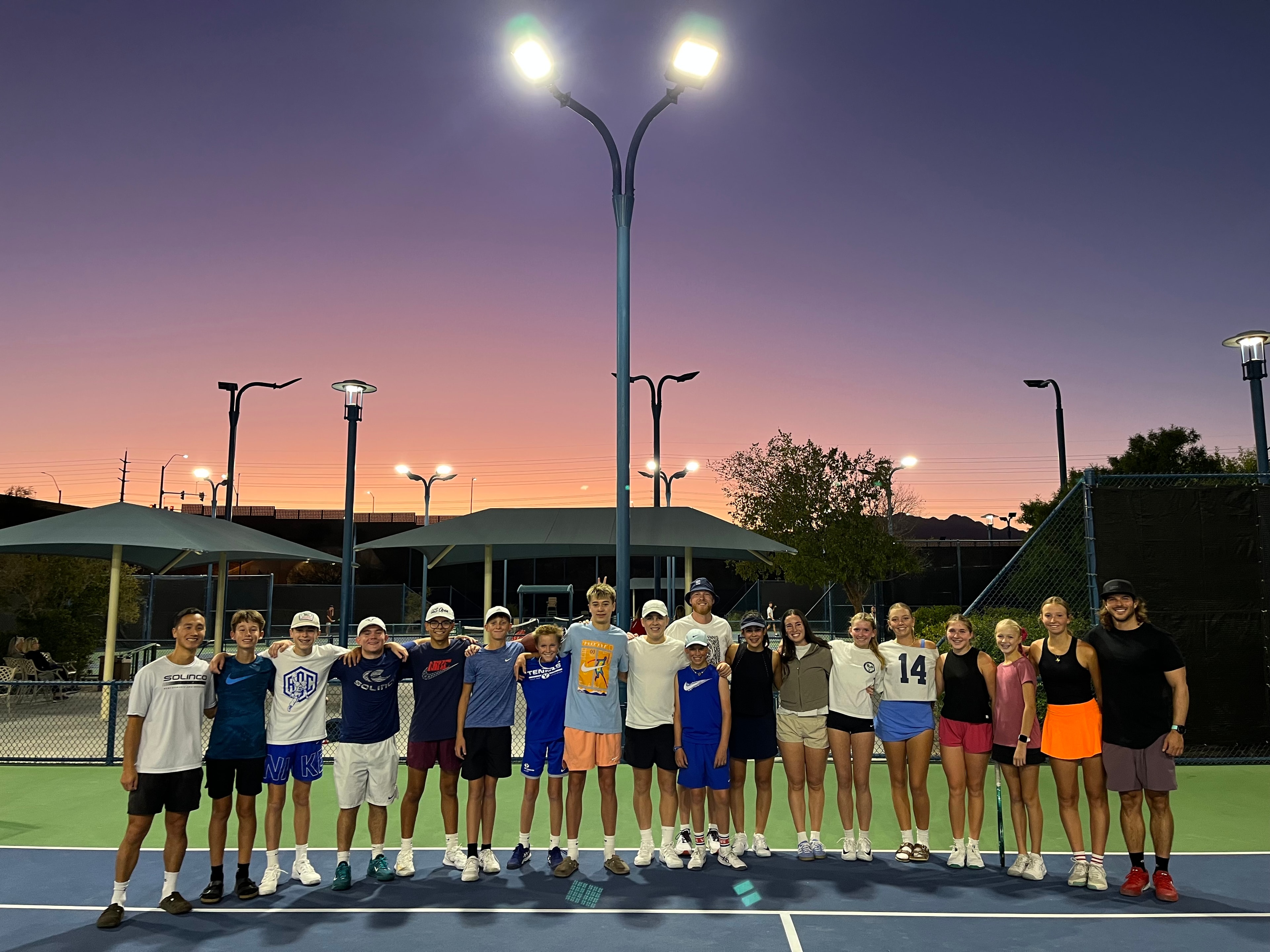 Tennis team group photo at sunset